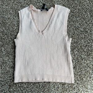 Light pink/tan sweater vest. Size medium.